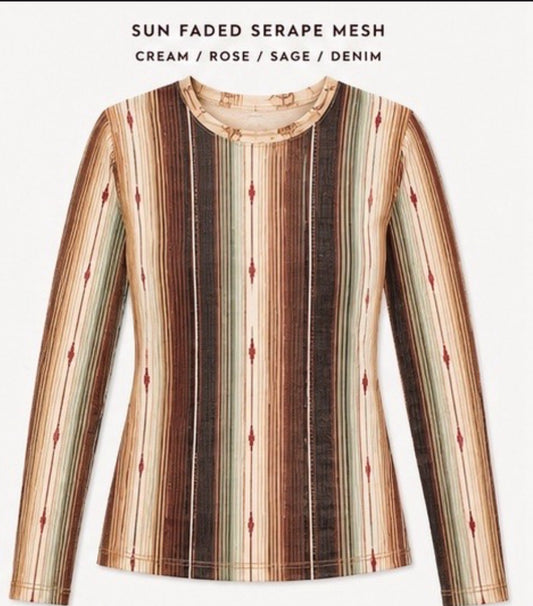 A long-sleeve mesh top with a vertical striped sun-faded serape pattern in cream, rose, sage green, and dark brown, featuring small red diamond accents. 