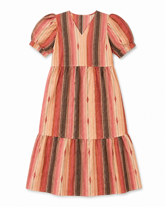 A tiered short-sleeve dress with puff sleeves, featuring a vertical striped pattern in shades of rust red, peach, orange, and dark brown, accented with small diamond motifs, shown against a plain white background.