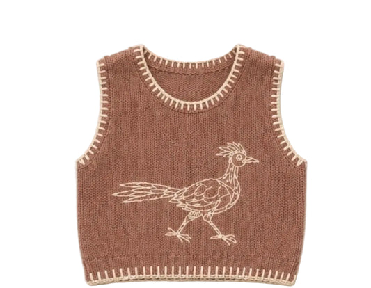 A brown knit vest with cream-colored border trim and a white embroidered road runner bird design, shown against a light beige background 