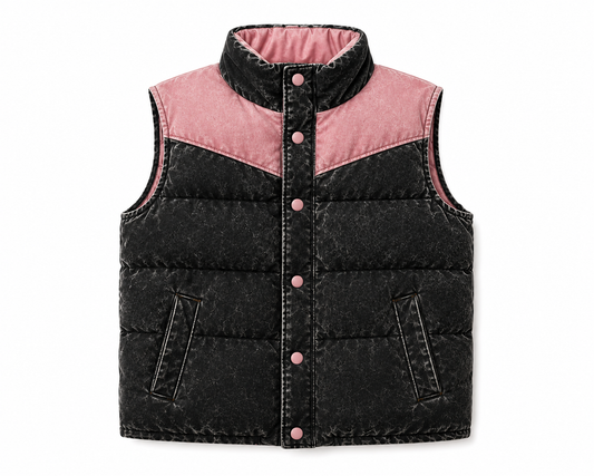 A sleeveless quilted puffer vest with a high stand-up collar, featuring a black washed outer shell, a pink inner lining, and pink buttons down the front.