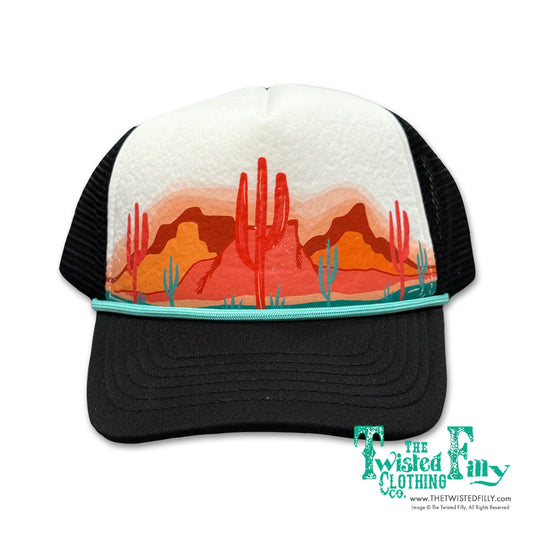 Trucker hat with desert landscape design and 'The Twisted Filly Co.' branding.